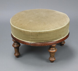 A Victorian circular mahogany stool raised on turned supports, upholstered in green material 39cm h x 58cm diam. 