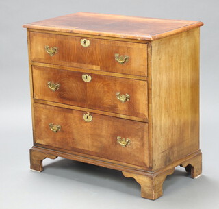 A Queen Anne style crossbanded walnut chest of 3 drawers with brass swan neck drop handles, raised on bracket feet 78cm h x 79cm w x 45cm d 