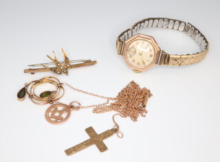 A 9ct yellow gold cross pendant and ditto chain 42cm together with an Edwardian yellow metal pendant set with peridot and seed pearls on a broken 9ct chain, yellow metal bird bar brooch and a Masonic pendant, gross weight 8.6 grams, together with a lady's 9ct yellow gold cased wristwatch 