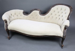 A Victorian carved mahogany show frame sofa, upholstered in white buttoned material, raised on cabriole supports 83cm h x 125cm w x 67cm d 