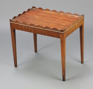 A Georgian style rectangular mahogany occasional table with wavy border raised on square tapered supports 45cm h x 51cm w x 36cm d 