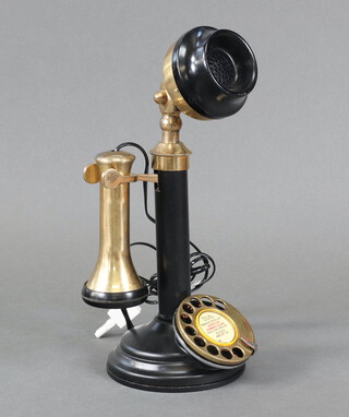 A reproduction gilt and black metal candlestick telephone 28cm x 13cm 