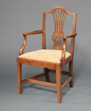 A 19th Century oak Hepplewhite style open armchair with pierced vase shaped slat back and drop in seat, raised on square tapered supports 96cm h x 56cm w x 44cm d 