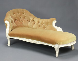 A Victorian white painted show frame chaise longue upholstered in mushroom coloured buttoned material, raised on cabriole supports 77cm h x 184cm w x 63cm d (seat 140cm x 42cm)  