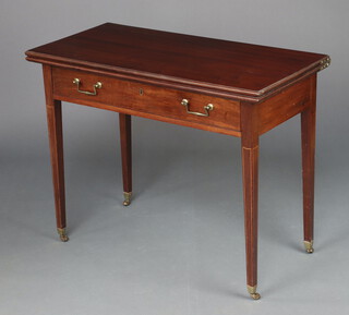 A Georgian mahogany tea table fitted a frieze drawer with brass swan neck drop handles, raised on square tapered supports, brass caps and casters 76cm h x 97cm w x 45cm d 