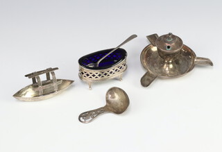An Edwardian silver cigarette lighter/ashtray, Chester 1905, a caddy spoon, mustard spoon, mustard and model boat, 119 grams 