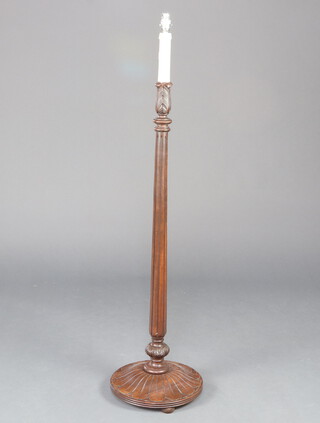 A Georgian style turned and fluted mahogany standard lamp on spreading foot 125cm h x 33cm diam. to base 