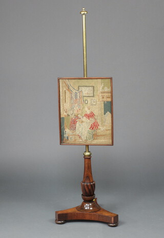 A rosewood pole screen with Berlin woolwork panel, raised on a baluster turned column and tripod base 131cm h x 40cm 