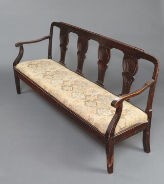A 19th Century Continental mahogany double chair back settee with pierced vase shaped slat back and upholstered drop in seat raised on square supports 85cm h x 180cm w x 47cm d (seat 150cm x 30cm) 