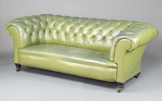 A 19th Century Chesterfield upholstered in green buttoned leather, raised on square supports 71cm h x 199cm w x 76cm d (seat 124cm x 46cm) 