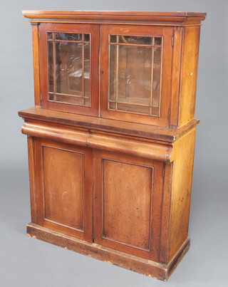 A Victorian mahogany chiffonier with raised back fitted a shelf enclosed by astragal glazed panelled doors, the base 2 short drawers above a double cupboard enclosed by panelled doors 155cm h x 107cm w x 43cm d 