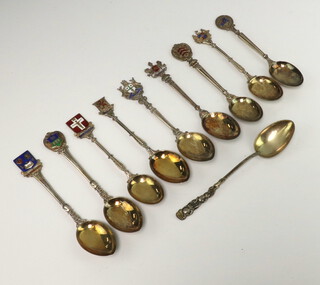 Nine silver and enamelled souvenir spoons, a white metal ditto Birmingham 1910/1911, 140 grams 