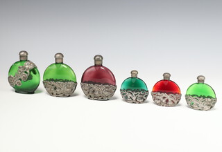 Six white metal mounted coloured glass scent bottles 