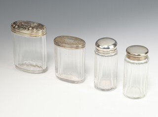 A silver mounted cut glass toilet jar London 1878 (chipped), 3 other mounted bottles