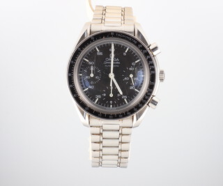 A gentleman's steel cased Omega Speedmaster automatic wristwatch with 3 subsidiary dials and original glass, the back numbered 56513526 with black dial, the Omega bracelet numbered 1469 