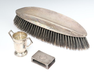 A silver trophy cup Birmingham 1908, a mounted brush and match holder 39 grams 
