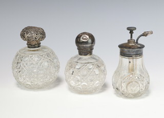 A Victorian silver mounted cut glass scent London 1888 10cm, ditto 11cm, an atomiser 12cm 