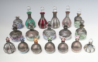 Eighteen Continental white metal mounted scent bottles 