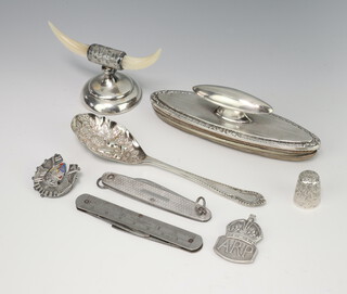 A silver and mother of pearl knife rest, a mounted nail buffer and minor items 