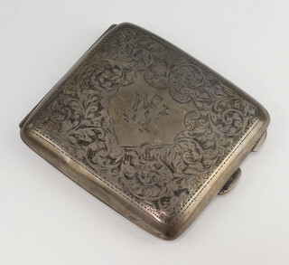 A silver engine turned cigarette case decorated with scrolls and monogram Birmingham 1945, 94 grams 