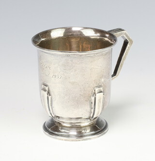 A silver Art Deco mug with strap work decoration engraved inscription Sheffield 1936 8cm, 143 grams
