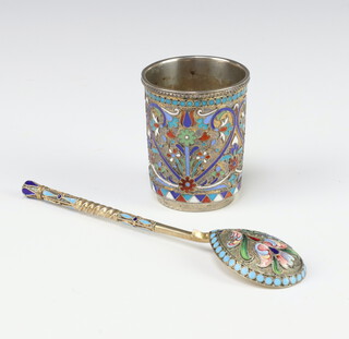 A Russian silver and enamelled tot decorated with coloured enamels of flowers and scrolls, fully marked 4.5cm, together with a ditto silver gilt spoon  maker Ivan Saltykov
