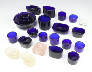 A collection of blue glass condiment liners 