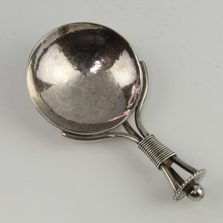 An Art Nouveau silver hammer pattern caddy spoon with spiral handle Birmingham 1912, maker A E Jones 21 grams 
