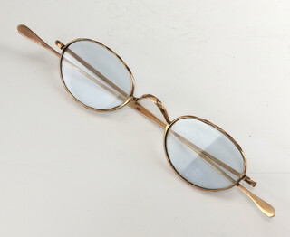 A pair of yellow metal spectacles engraved J Troulan Plymouth 