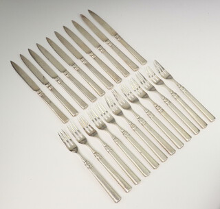 A set of Chinese silver dessert cutlery by Wang Hing comprising 10 knives and 12 forks 733 grams 