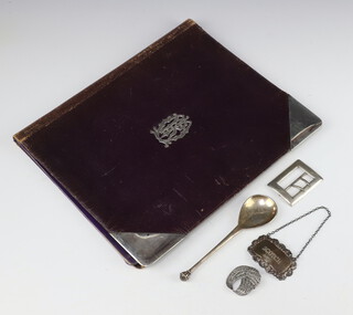 An Edwardian silver mounted leather blotter London 1900, a silver apostle spoon, buckle, spirit label, paste brooch, weighable silver 82 grams 