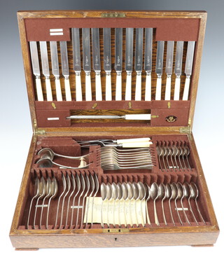 A canteen of Old English pattern silver plated cutlery for 8 (65) contained in an oak canteen 