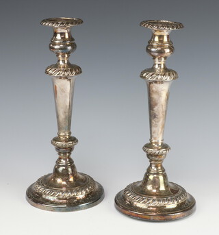 A pair of silver plated tapered candlesticks 30cm 