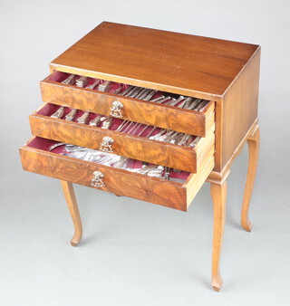 A canteen of mixed Kings Pattern silver plated flatware, contained in a 3 drawer box on cabriole supports 