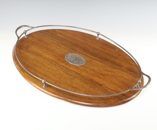 An Edwardian oval oak tray with silver plated gallery 62cm 