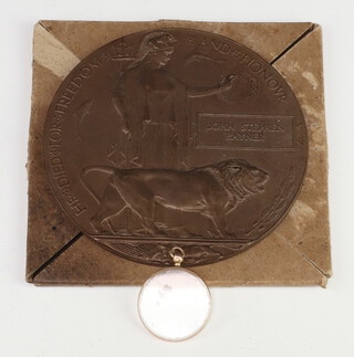A First World death plaque to John Stephen Rayner with original cardboard envelope together with a photographic locket of Rayner in military uniform in a 9ct gold mount 
