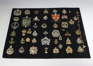 A collection of 40 Canadian cap badges