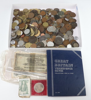 A collection of Continental bank notes and coins