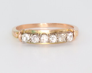 A yellow metal 6 stone diamond ring, approx. 0.3ct, size P 1/2 
