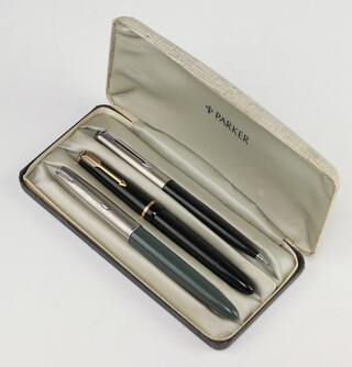 A Parker 51 fountain pen, a black Parker Duofold fountain pen and a black Parker ballpoint ben cased 