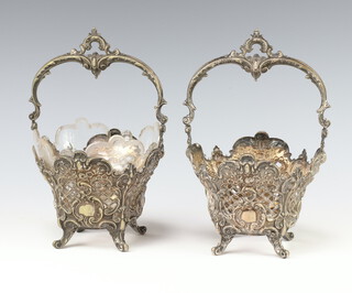 A pair of Continental pierced and embossed 800 standard baskets, the base marked 800 Matzner, 1 with glass liner (f and r) 