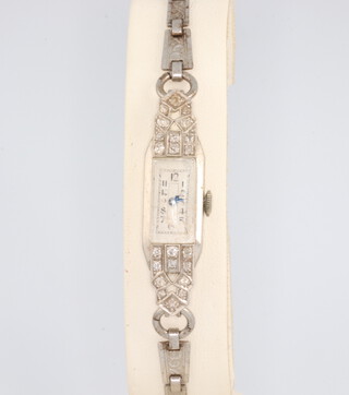 An Art Deco diamond set platinum wristwatch on a steel bracelet 