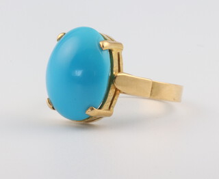 A yellow metal stamped 18ct turquoise set ring, size M 