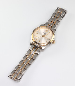 A lady's steel cased Tissot calendar wristwatch on a bimetallic bracelet 