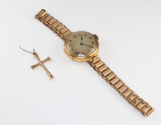 A lady's 9ct gold cased wristwatch on a gilt strap together with a 9ct yellow gold cross pendant 