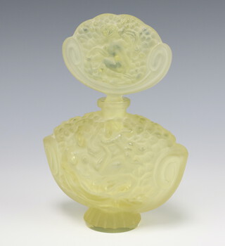An Art Deco style yellow moulded glass scent bottle and stopper depicting naked reclining ladies 19cm 