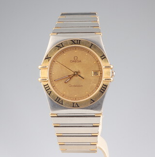 A gentleman's steel and gilt Omega constellation calendar wristwatch, 30mm case, with bi-metallic bracelet  
