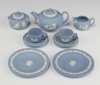 A Wedgwood blue Jasper miniature tea set comprising teapot and lid, sugar bowl and lid, milk jug, 2 tea cups, 2 saucers, 2 dinner plates 