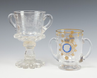 A commemorative glass 2 handled cup George V and Queen Mary crowned June 22nd 1911 with inset coin to stem 22cm, a ditto George VI and Queen Elizabeth May 1937 16cm 