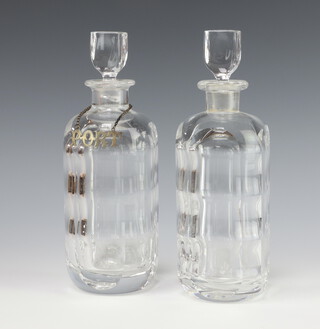 A pair of Orrefors clear glass spirit decanters and stoppers 26cm 